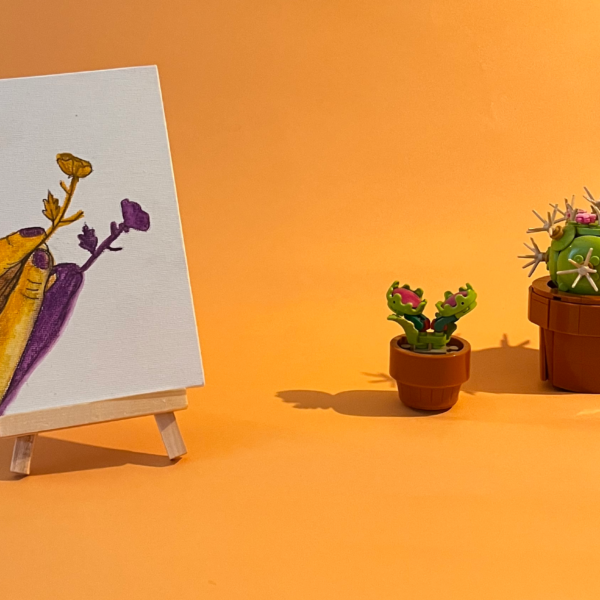 Photographie de l'oeuvre unique originale : une main tenant une fleur, on voit aussi son ombre projetée au sol en violet