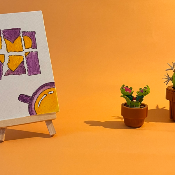 Photographie de l'oeuvre unique originale : un souvenir déchiré sur lequel un coeur est dessiné, au coin une tasse de chocolat froid